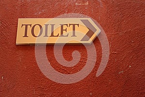 Toilet vintage label on a brown background.