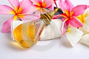 Toiletries with plumeria flower and towel