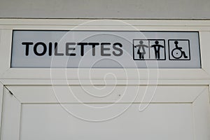Toilettes publique french text public toilets for wc with icon woman man and disabled person photo