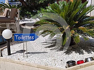 Toilettes sign with natural background photo