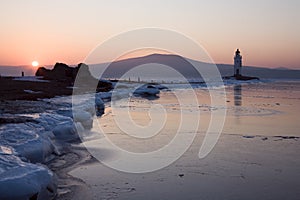 Tokarev lighthouse in the morning on the background of Russian island, Vladivostok