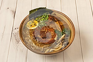 Tokio ramen with meat, noodles, mushrooms and seaweed cooked photo