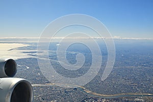 Tokyo Area from Airplane Window Jet Engine Wing