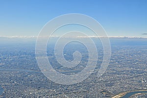 Tokyo Area from Airplane Window Jet Engine Wing