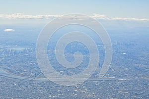 Tokyo Area from Airplane Window Jet Engine Wing