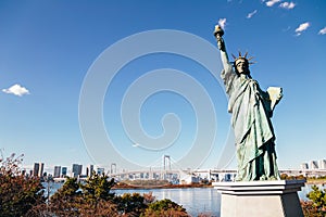 Tokyo bay and Odaiba Rainbow bridge and Statue of Liberty in Japan