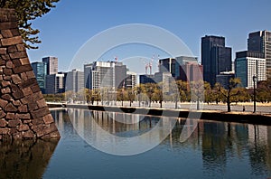 Tokyo City View from the moat near the Imperial Palace in Tokyo, Japan.