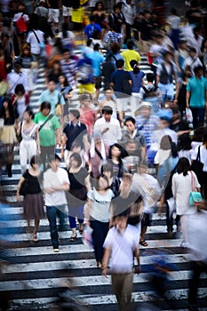 Tokyo crowd in motion at Shibuya Crossing photo