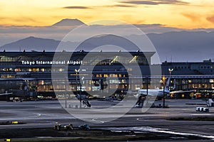 Tokyo Haneda Airport with Fuji mountain background at Sunset, Tokyo, Japan