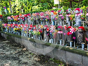 TOKYO, JAPAN - APRIL 5: Jizo Boddhisattvas at Zojo Buddhist Temple at Tokyo, Japan. Jizo Bodhisattva is the patron saint