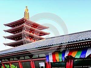 TOKYO, JAPAN - APRIL, 18, 2018: pagoda tower and flags at sensoji temple