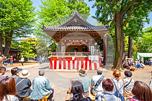 People perform Japanese fan dance  in Bunkyo Azalea Festival Tsutsuji Matsuri at Nezu Shrine