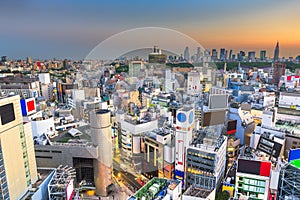Tokyo, Japan city skyline over Shibuya Ward with the Shinjuku Ward skyline in the distance photo