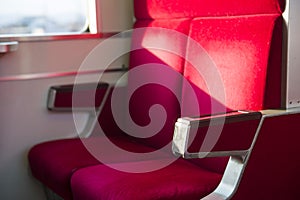 TOKYO, JAPAN - FEBRUARY 21, 2016 : red seats inside trains at Ja