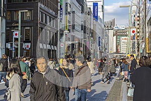 People walking and relaxing on Ginza street in Tokyo, Japan