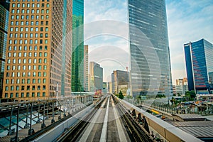 TOKYO, JAPAN JUNE 28 - 2017: Scenery of a train traveling on the elevated rail of Yurikamome Line in Odaiba, Minato