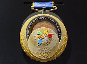 Official gold medal used during the 1998 Winter Olympics of Nagano .