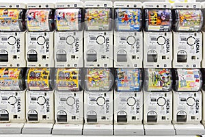 Tokyo, Japan - March 1, 2018 : Gachapon, row of white Japanese capsule toy vending machine in Narita international airport