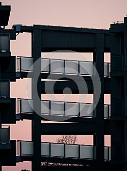 A silhouette of a staircase of a condo at dawn in Tokyo