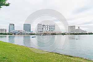 Tokyo, Japan - NOV 16, 2016 : Tokyo cruise boat cruising infront of Odaiba Aqua city shopping mall and Fuji Television