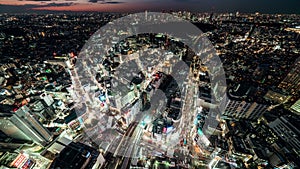 Tokyo, Japan - Nov 5, 2019: day to night time lapse of Tokyo cityscape, Shibuya scramble crossing, and car traffic transport