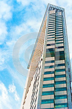 TOKYO, JAPAN - OCTOBER 31, 2017: View of a tall building in the center of the city. Vertical. Bottom view. Copy space for text.