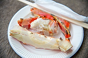 Tokyo, Japan Street in Tsukiji outer market in Ginza with closeup retail sample display of cooked red crab lobster legs white meat