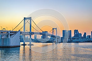 Tokyo Japan sunset city skyline at Odaiba Rainbow Bridge