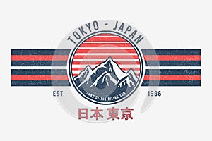 Tokyo, Japan t-shirt design with mountains and sun. Tee shirt graphics print with stripes, grunge and inscription in Japanese