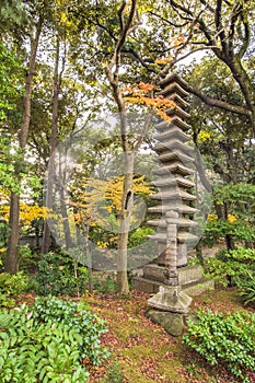 Tokyo Metropolitan Park KyuFurukawa japanese garden`s ruins of a giant thirteen storied stone pagoda Kuyoto