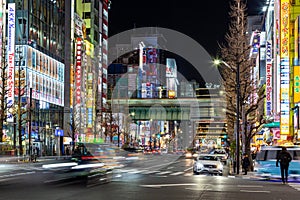 Tokyo`s famous electronics shopping area, Akihabara`s main street neon signs light up the night