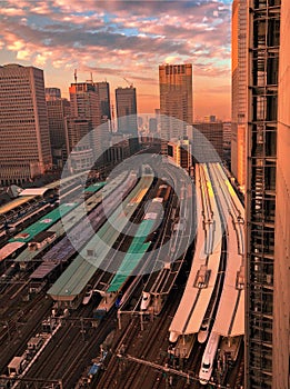 Tokyo skyline with high speed, Shinkansen, trains in foreground.