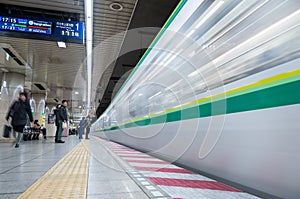 Tokyo Subway Metro Station with Fast Moving Train