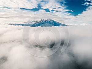 Tolbachik volcano with clouds in Kamchatka, Russia
