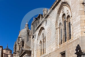 Toledo Cathedral (The Primatial Cathedral of Saint Mary of Toledo) richly decorated Gothic facade, Spain. photo