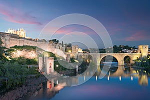 Toledo city during twilight night. Landscape of Toledo, UNESCO World Heritage. Historical building near Madrid, Spain photo