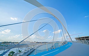 Tolerance bridge. Structure of architecture with lake or river, Dubai Downtown skyline, United Arab Emirates or UAE. Financial