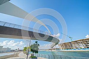 Tolerance bridge. Structure of architecture with lake or river, Dubai Downtown skyline, United Arab Emirates or UAE. Financial