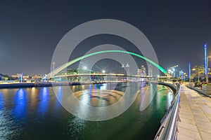 Tolerance bridge. Structure of architecture with lake or river, Dubai Downtown skyline, United Arab Emirates or UAE. Financial
