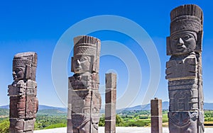 Toltec warrior statues topping on Quetzalcoatl pyramid, Tula archaeological site, Mexico photo