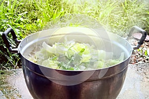 Tom Jab Chai is mixed vegetables stew boiling in pot