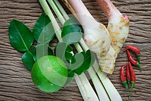 Tom yam ingredient lemon, lemongrass, galangal and chili on wood