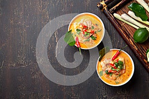 Tom Yam Kung ,Prawn and lemon soup with mushrooms, thai food in two white bowl top view