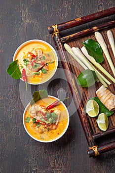 Tom Yam Kung ,Prawn and lemon soup with mushrooms, thai food in two white bowl top view