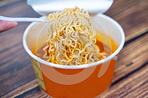 Tom yum goond instant noodles in paper cup
