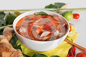 Thai Tom Yum Goong or spicy tom yum soup with prawns shrimps