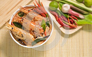 Tom Yum Goong spicy soup traditional thai food cuisine in Thailand on mat wicker background,Tom Yum Kung,Thai Food