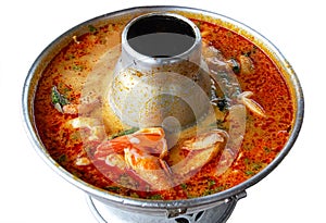 Tom Yum Kung or Prawn spicy soup, Thai famous traditional Sea food soup served in hot pot. Tom Yam is a spicy and sour soup that