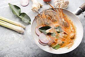 Tom yum kung or tom yam kung  is a type of hot and sour famouse food in Lao and Thai soup,usually cooked with shrimp.Tom yum has