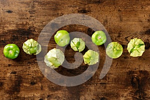 Tomatillos, green tomatoes, shot from above with copy space